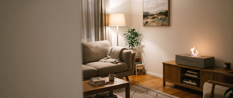 A bioethanol fire pit with a real flame used indoors on a console in a normal Australian living room