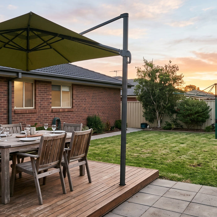 Large square cantilever patio umbrella shading an outdoor dining table for six in a tidy Australian suburban backyard
