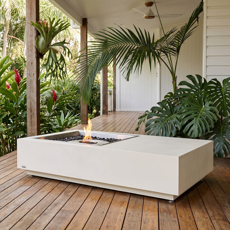 EcoSmart Manhattan 50 bioethanol fire table glowing on a tropical Queenslander deck at dusk