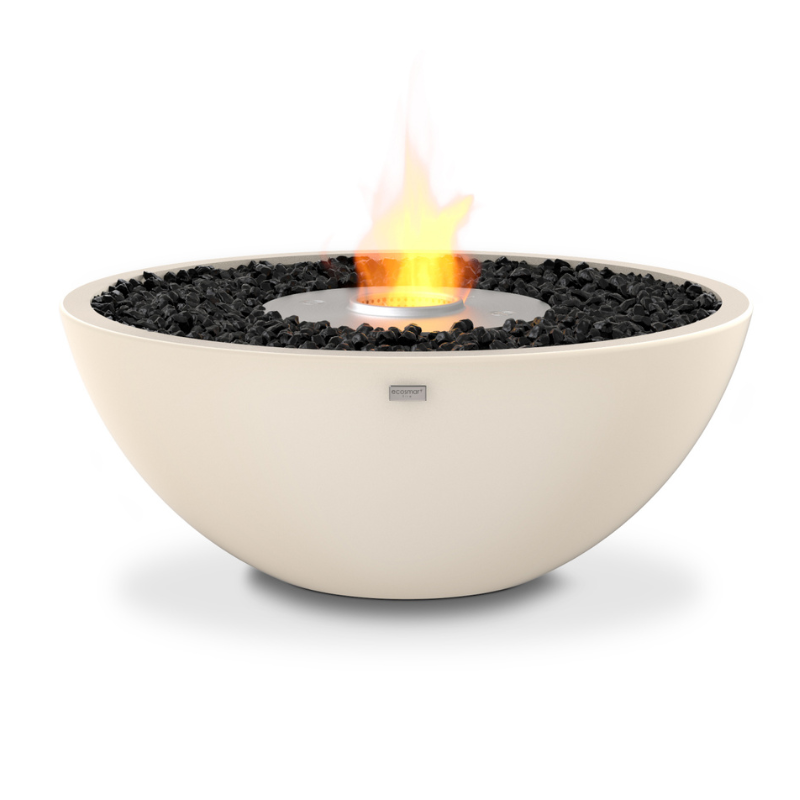 EcoSmart Mix 850 bioethanol fire pit in Bone concrete, alight, with the flame held in its stainless steel burner and black glass media around it