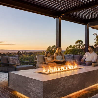 Luxury propane fire table under a covered Australian patio at sunset.