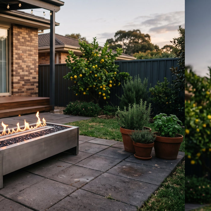 Modern bioethanol fire table with a clean flame over dark fire glass on a paved patio in a tidy Australian suburban backyard at dusk