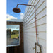 Handmade Banksia copper and brass hot and cold outdoor shower mounted against a wall.