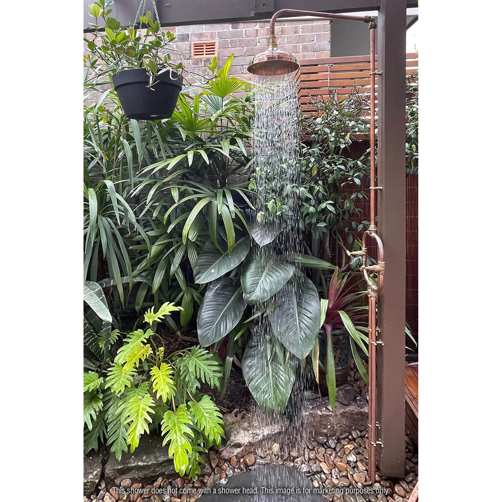 Handmade Waratah slim copper and brass hot and cold outdoor shower on a post.