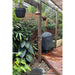 Handmade Waratah slim copper and brass hot and cold outdoor shower on a post.