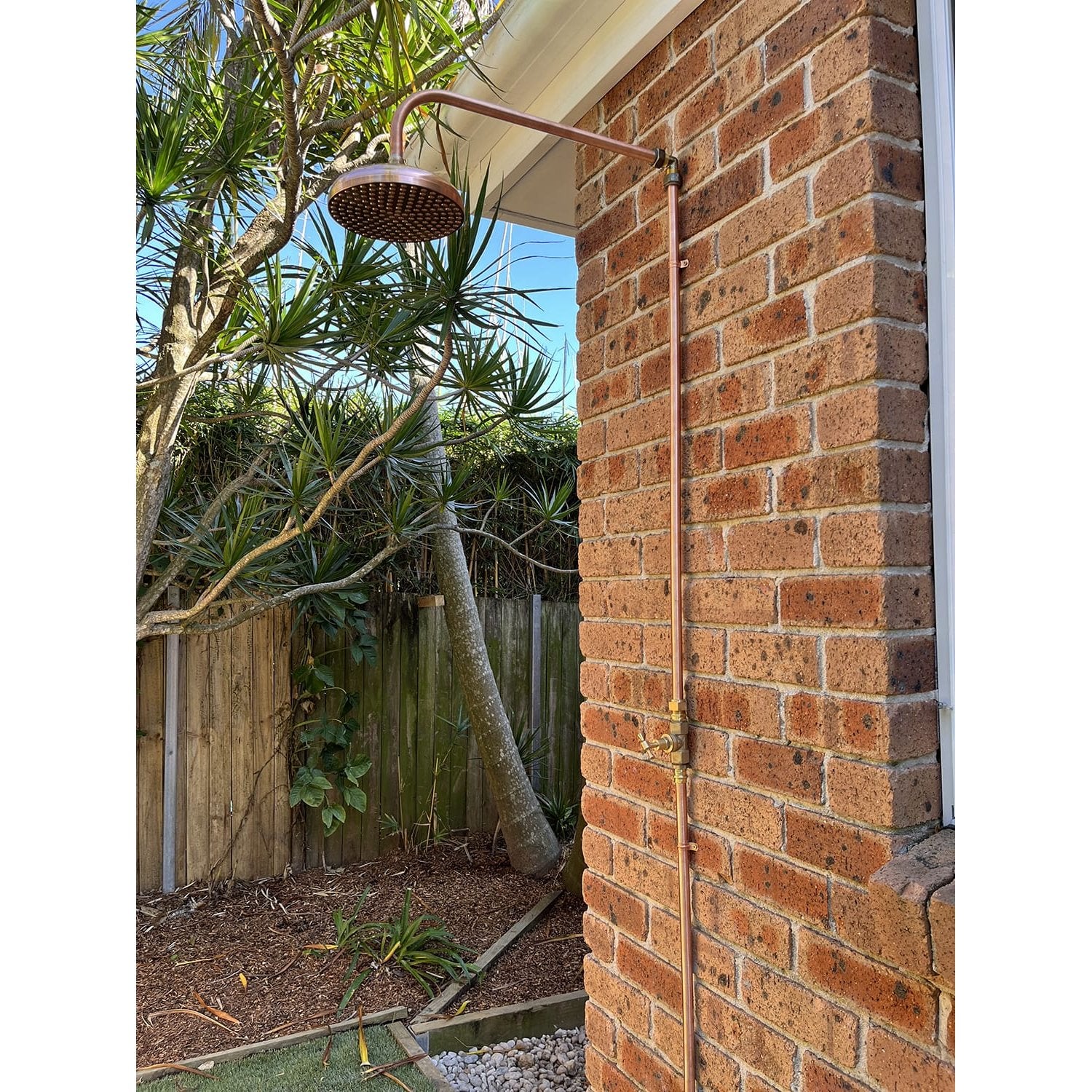 Handmade Bottlebrush copper and brass cold-only outdoor shower.