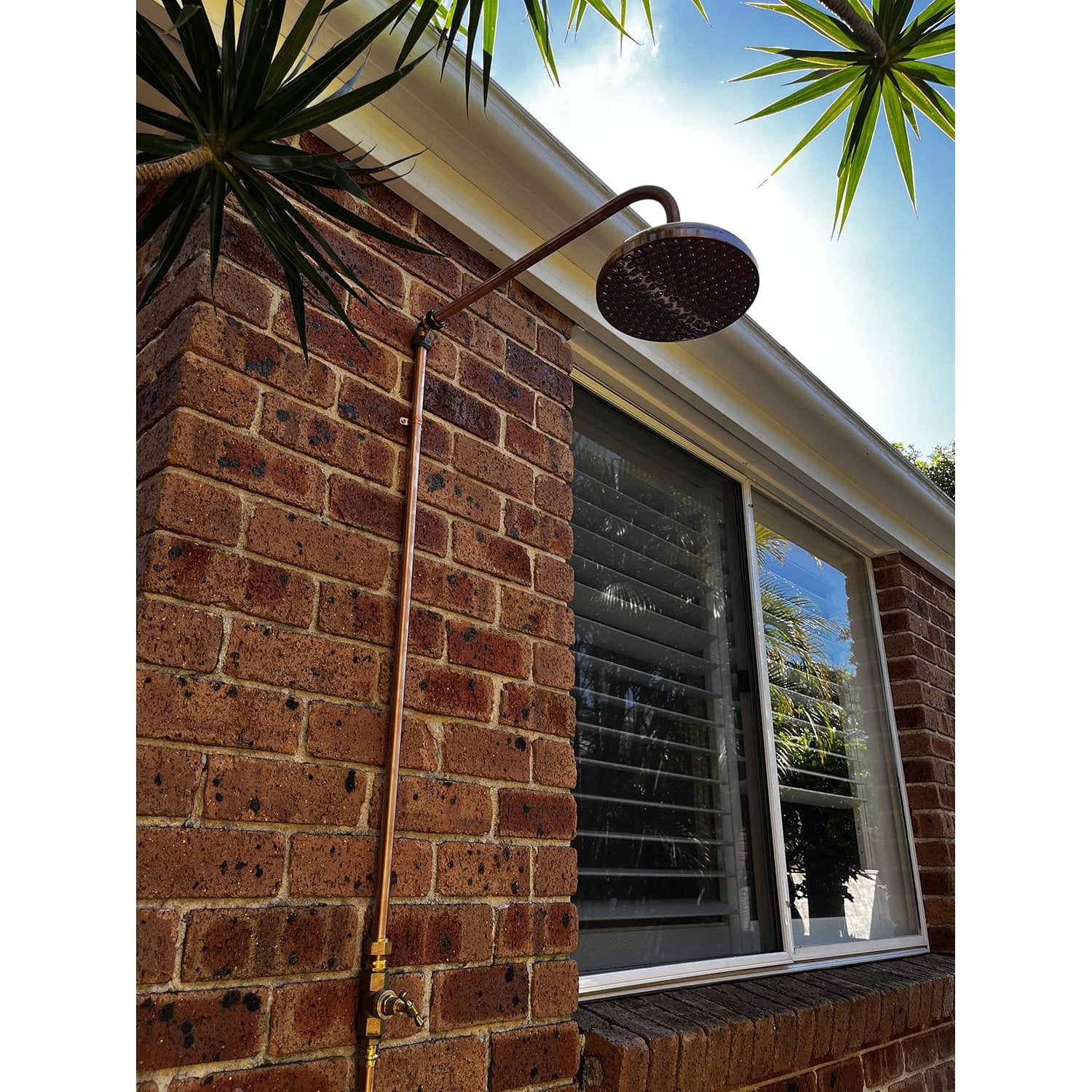 Handmade Bottlebrush copper and brass cold-only outdoor shower.