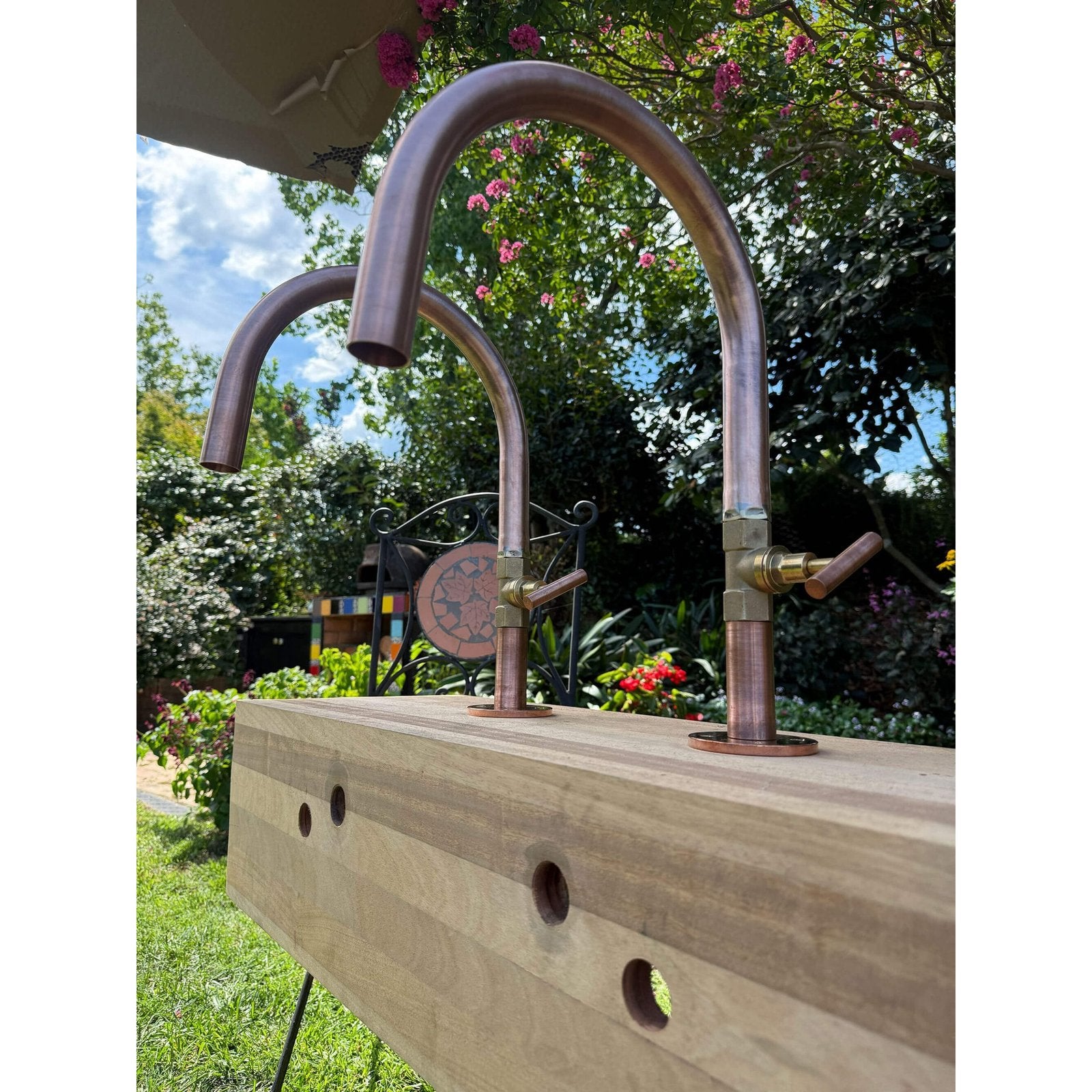 Handmade Hakea 32mm copper bath pillar tap with gooseneck spout.