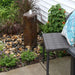 Aquascape Faux Basalt Column fountain, 61cm, bubbling over stones in a garden bed