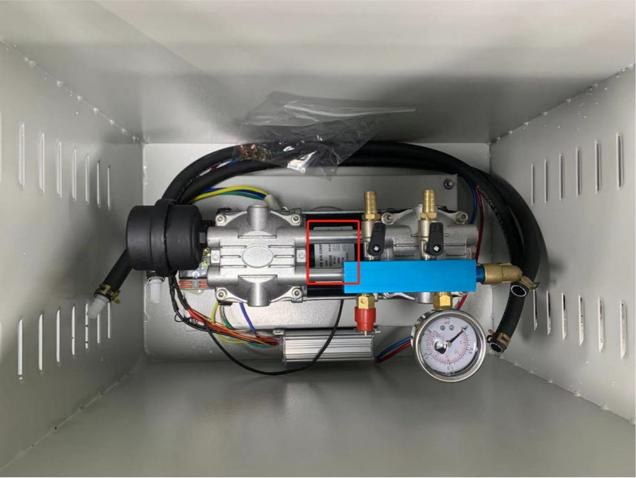Interior of the ASA solar aerator cabinet showing the compressor, two-way manifold and controller