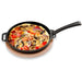 Witt round cast iron cooking pan holding a baked vegetable dish