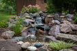 A 2m pondless waterfall stream built with the Aquascape Small Pondless Waterfall Kit, running over rock into a gravel bed