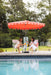 Villa valance umbrella, Musk canopy, over a table setting beside the pool
