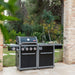 Coleman Revolution 4 Burner outdoor kitchen with the sink module in a garden setting