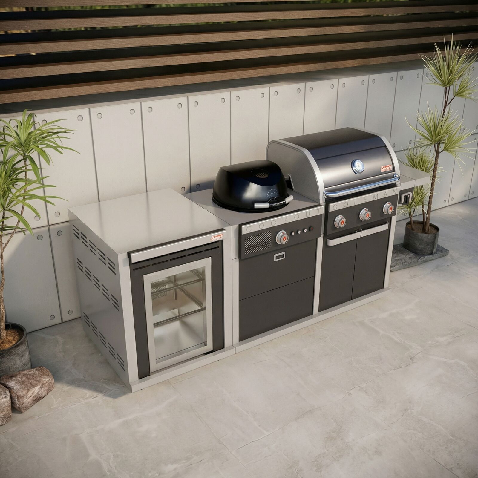 Coleman Revolution Dual Fuel outdoor kitchen in Black Gloss against a rendered alfresco wall