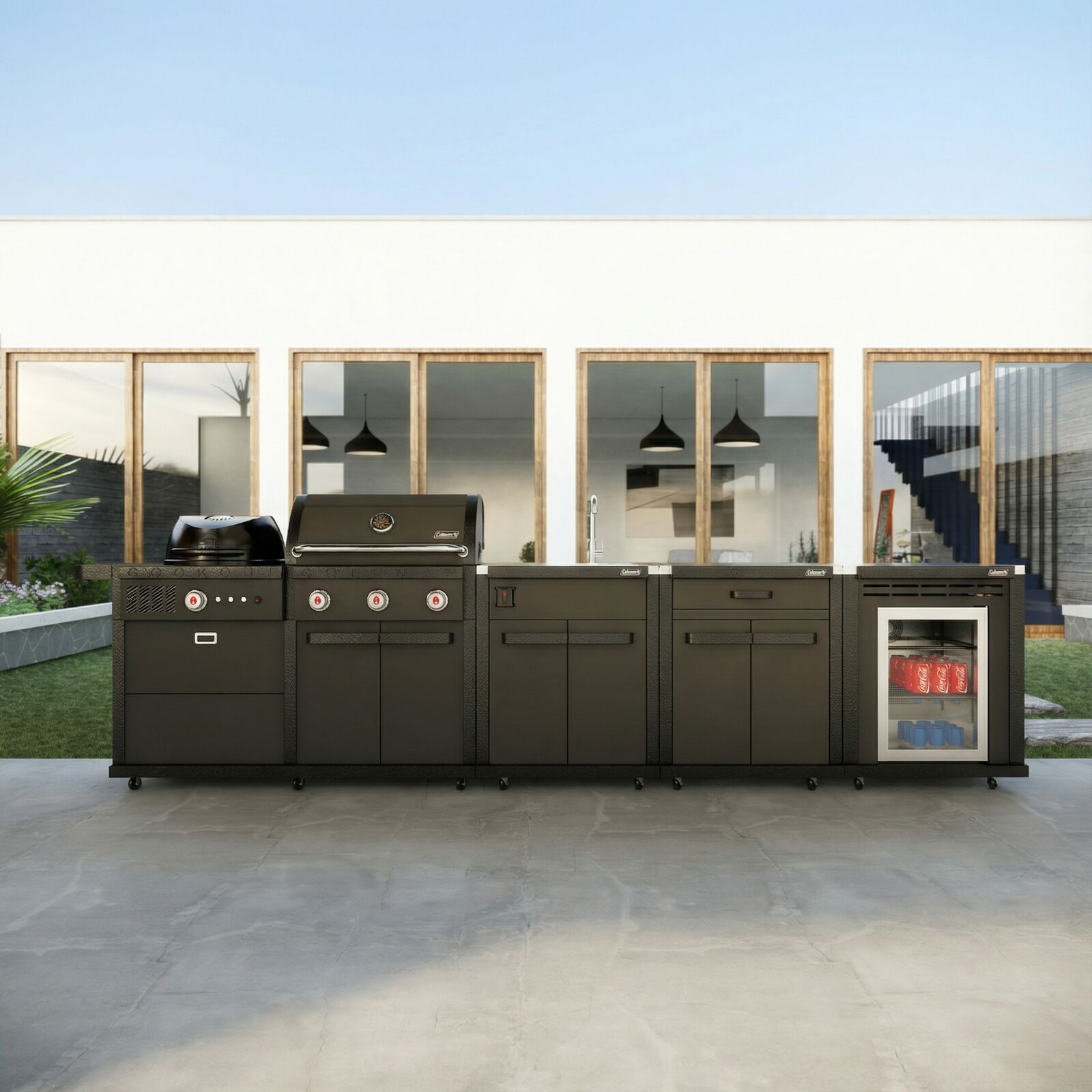 Coleman Revolution Dual Fuel outdoor kitchen in Matt Black outside a modern home