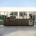 Coleman Revolution Dual Fuel outdoor kitchen in Matt Black outside a modern home