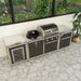 Angled view of the Coleman Revolution Dual Fuel outdoor kitchen run against a courtyard wall