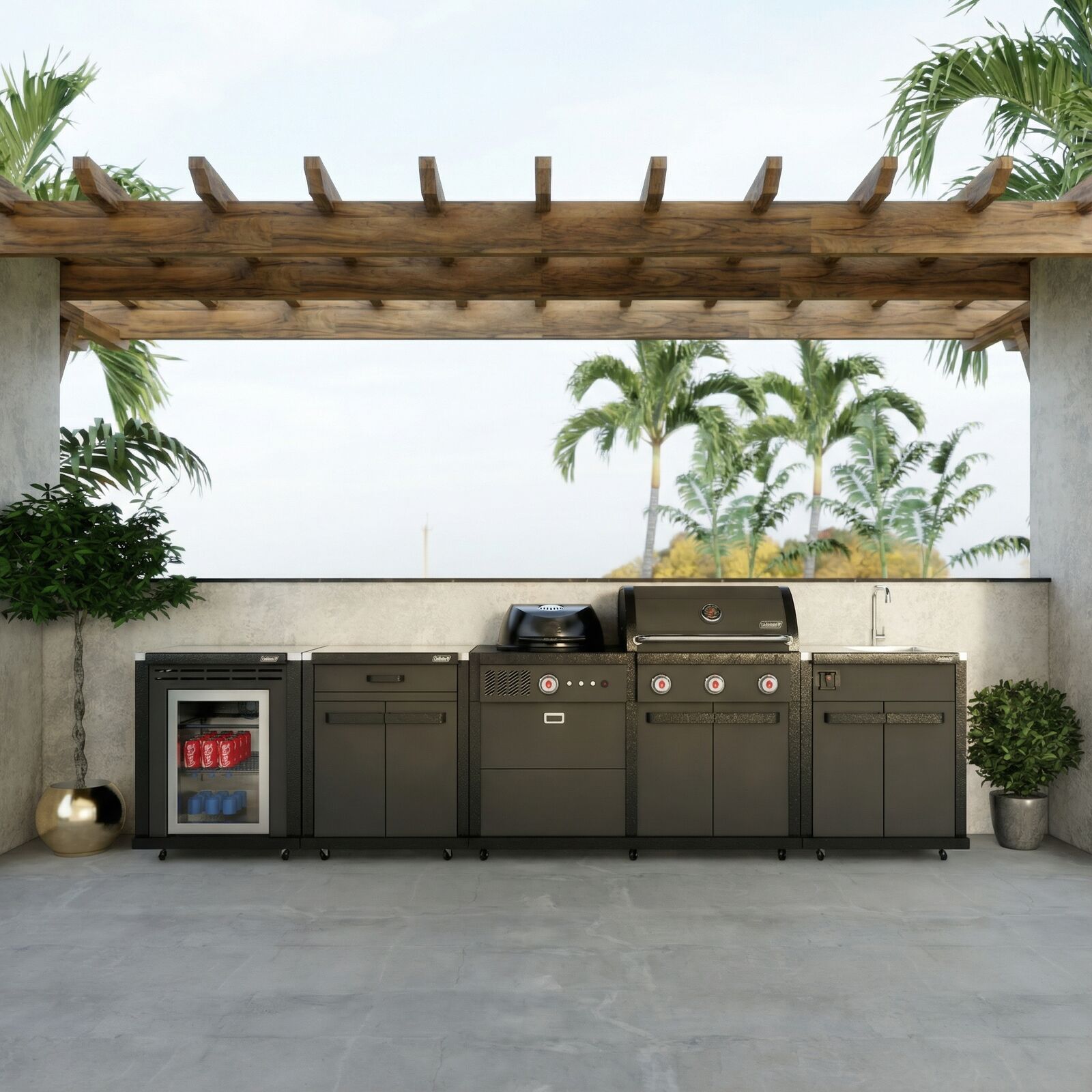 Coleman Revolution Dual Fuel outdoor kitchen in Matt Black under a pergola beside palms