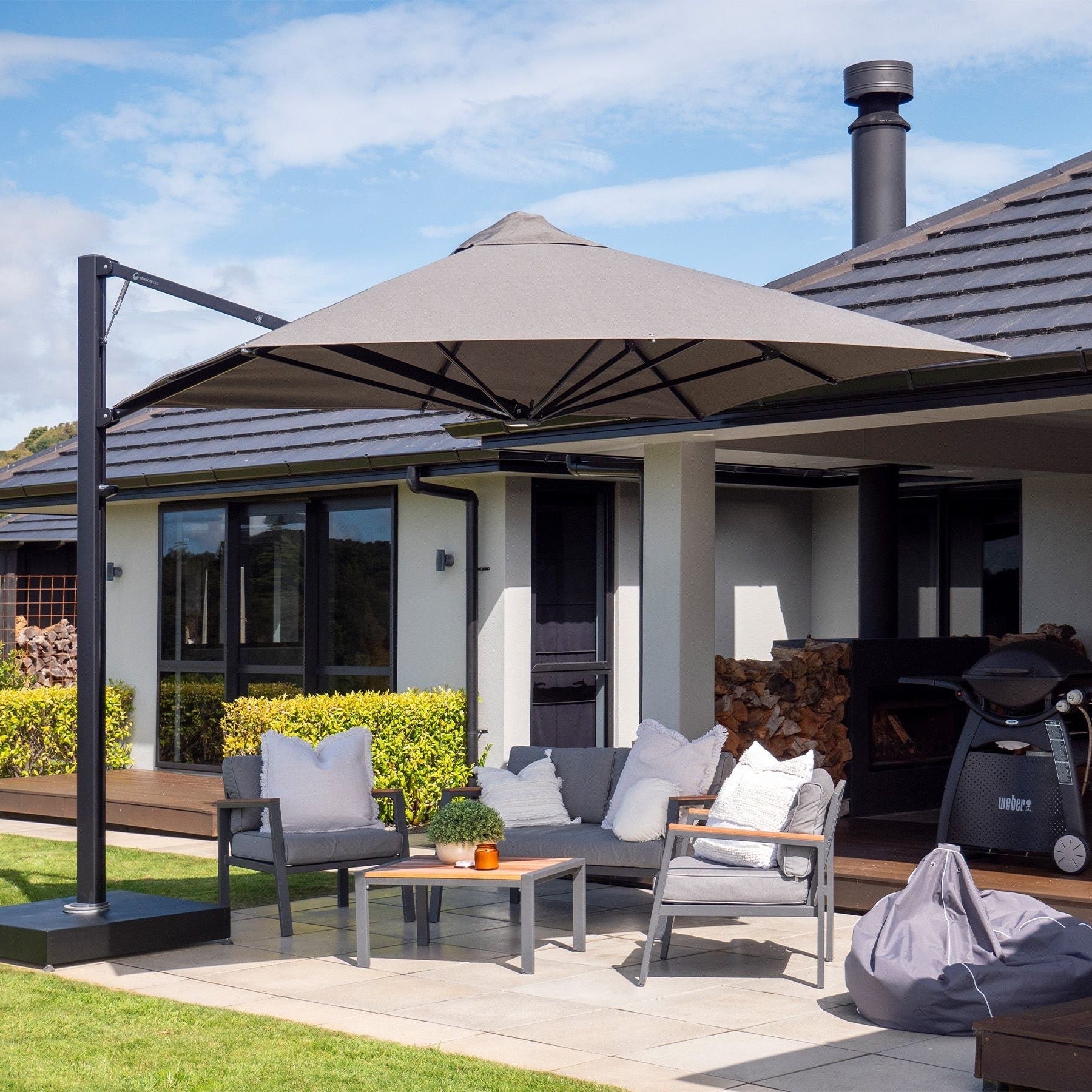 Shadowspec Serenity square-canopy umbrella on a free standing base on a patio