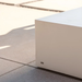 White Bloc 40 square concrete coffee table detail in an outdoor patio setting