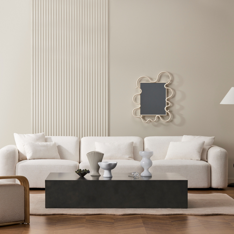 Move 65 rectangular concrete coffee table styled in a contemporary living room with sofa and decor