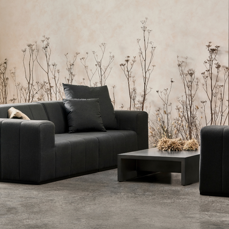 Niche 50 concrete coffee table styled in a modern living room with contemporary lounge seating