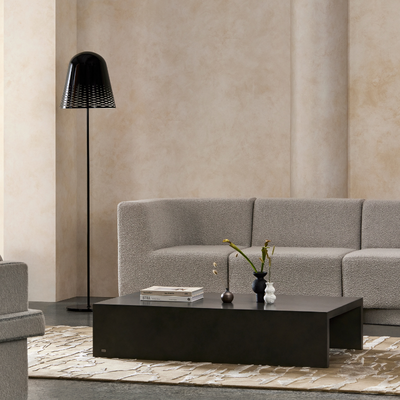 Niche 50 concrete coffee table styled with sofa, decorative objects and modern lighting