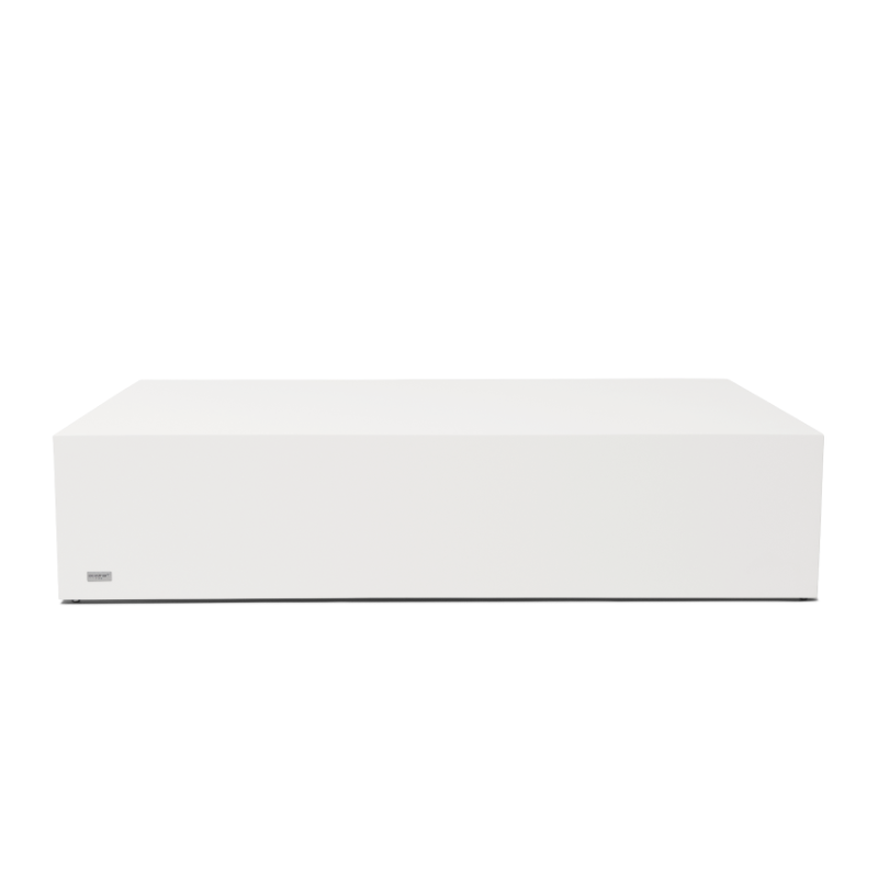 Low profile view of the Niche 50 concrete coffee table in bone finish with open shelf design