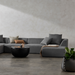 Blinde Design Stitch 25 planter styled in a contemporary living room with sectional sofa and decor
