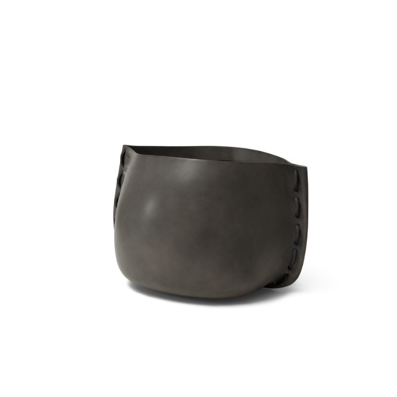 Stitch 25 round concrete planter by Blinde Design in natural finish with black stitched accent detail