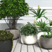 Blinde Stitch concrete planters with greenery arranged on a modern outdoor deck