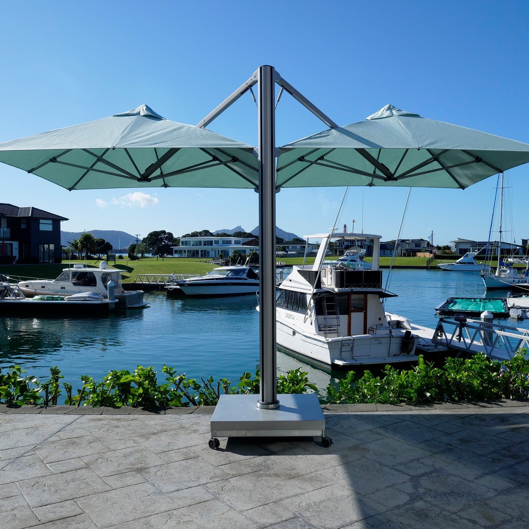 Shadowspec free-standing base fitted with castor wheels on a waterfront patio