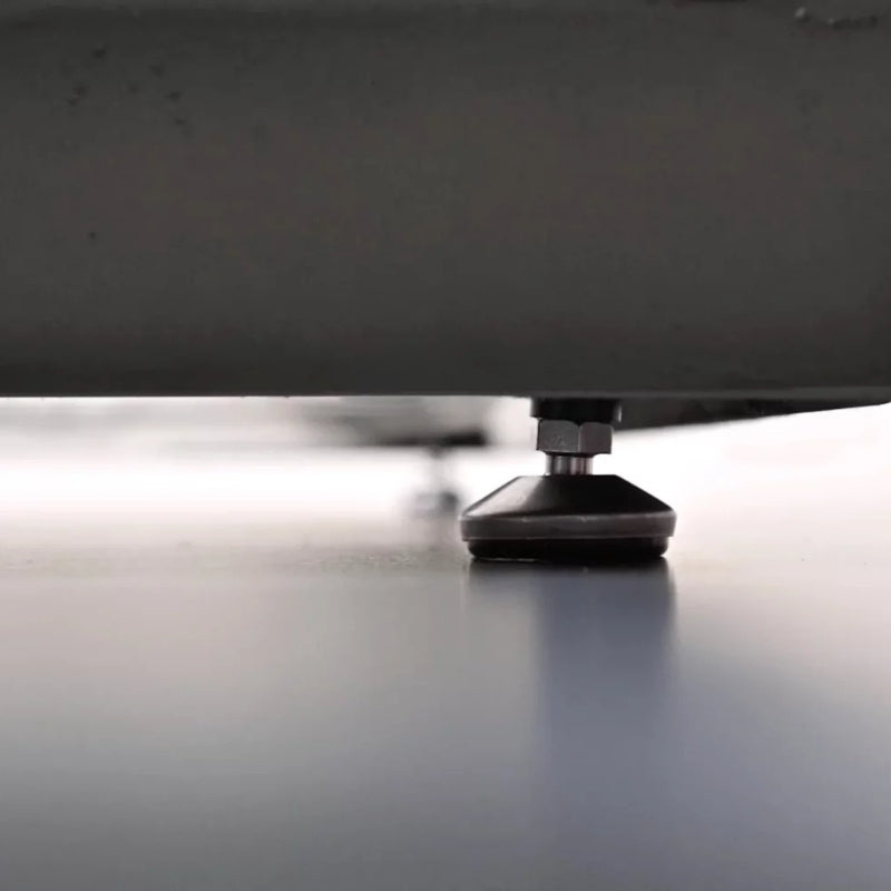 Close-up detail of adjustable leveling foot on Circ 40 round coffee table base