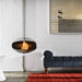 Cocoon Aeris Hanging Bioethanol Fireplace in stainless steel hanging in a white brick lounge