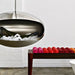 Cocoon Aeris Hanging Bioethanol Fireplace in stainless steel filled with ice as a drinks server