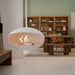 Cocoon Aeris Hanging Bioethanol Fireplace in matt white hanging in a dining room