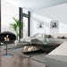 Cocoon Pedestal Bioethanol Fireplace in matt black in a high rise apartment lounge