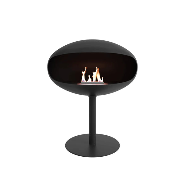 Cocoon Pedestal Bioethanol Fireplace in matt black, studio shot with flame lit