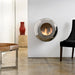 Cocoon Vellum Wall Mounted Bioethanol Fireplace in stainless steel beside a leather bench and dining chair
