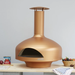 Copper Polito Giotto Oven BTS for sale positioned on an outdoor preparation bench beside fresh ingredients and pizza making accessories