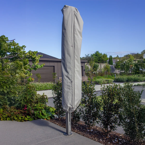 Shadowspec protection cover fitted over a folded Serenity cantilever umbrella
