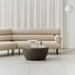 Curv 30 round coffee table in bronze finish styled in a modern living room with sofa and decor
