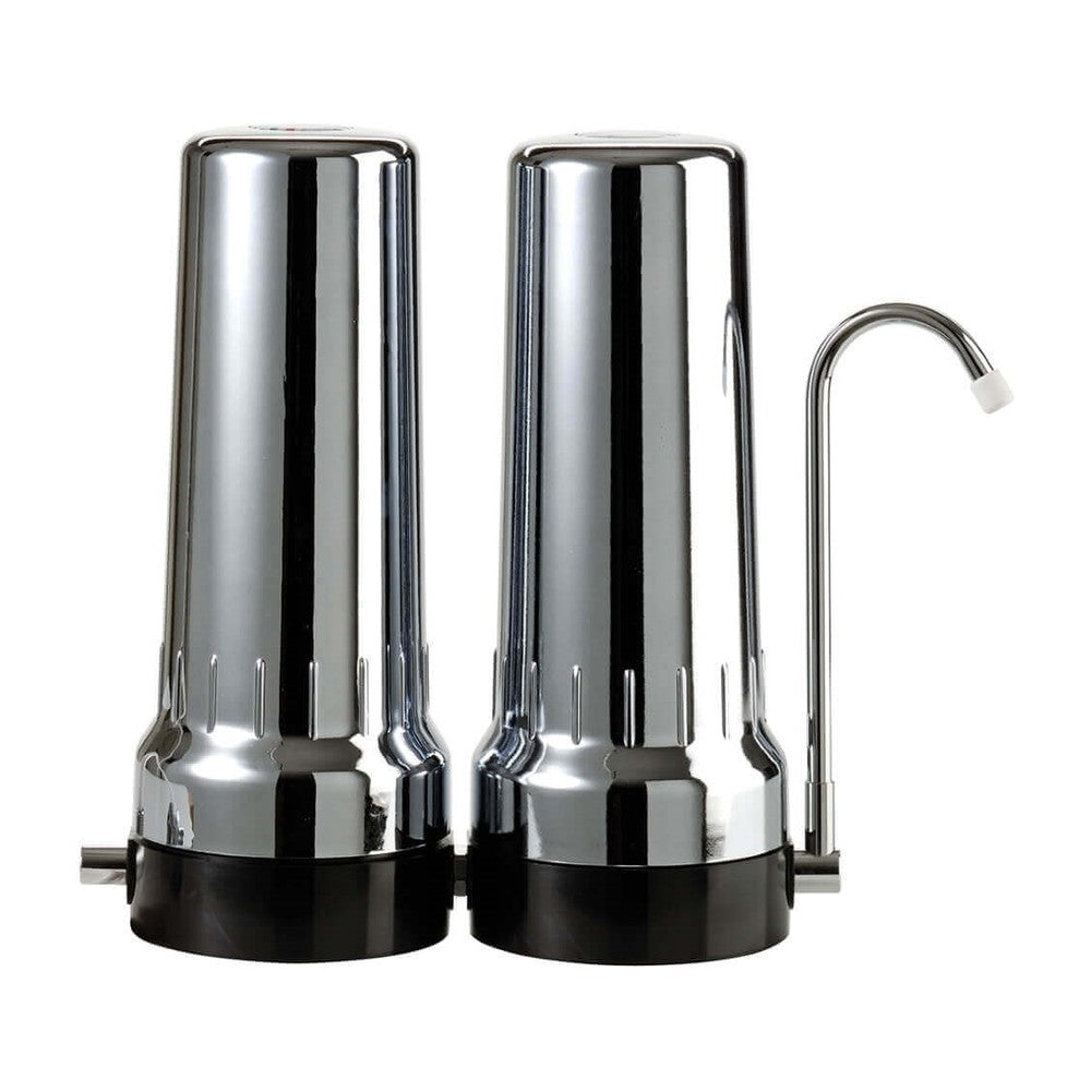 Depural Duo benchtop water filter kit with two chrome housings on a black base and a swan-neck tap