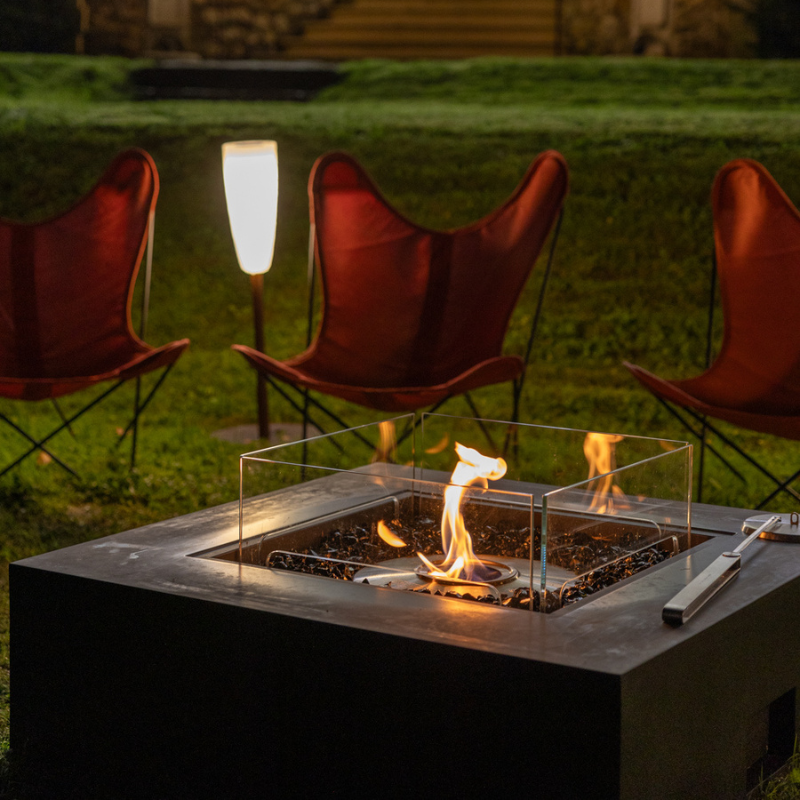 Close-up of EcoSmart Base 40 fire table flame with glass wind guard and burner detail