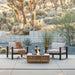 EcoSmart Base 40 fire table with lounge chairs on a desert terrace, Joshua trees beyond.