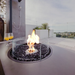 EcoSmart Fire R20 Screen installed on round outdoor fire table with active flame