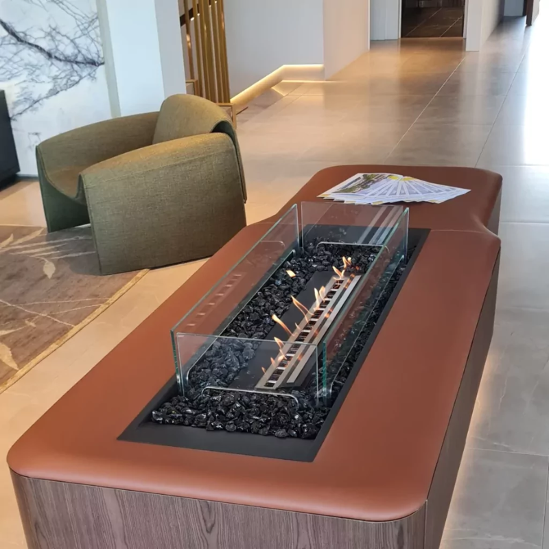 EcoSmart Linear 65 Fire Pit Kit integrated into a contemporary indoor living space with a stylish wooden table design and burning flame