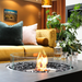 EcoSmart Martini 50 in Graphite Fluid concrete with a Stainless Steel burner, in a contemporary indoor living room.