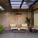 EcoSmart Martini 50 in Natural Fluid concrete with a Stainless Steel burner in an outdoor lounge setting.